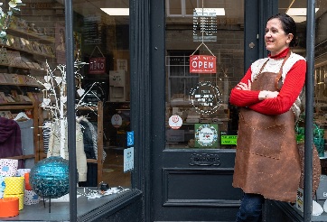 Small business owner outside a shop